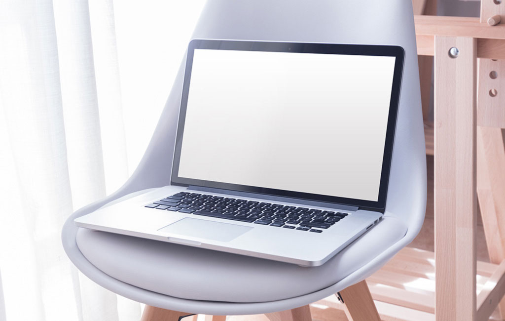 A blank screen  laptop on chair