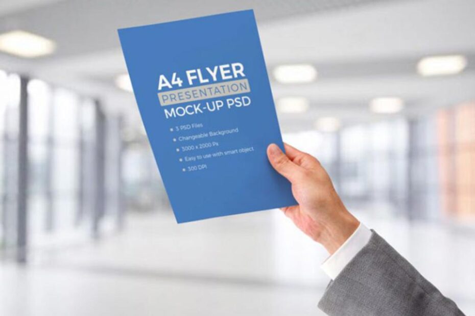Free Flyer in Hand Mockup