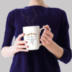 Free Women Holding Coffee Mug Mockup PSD
