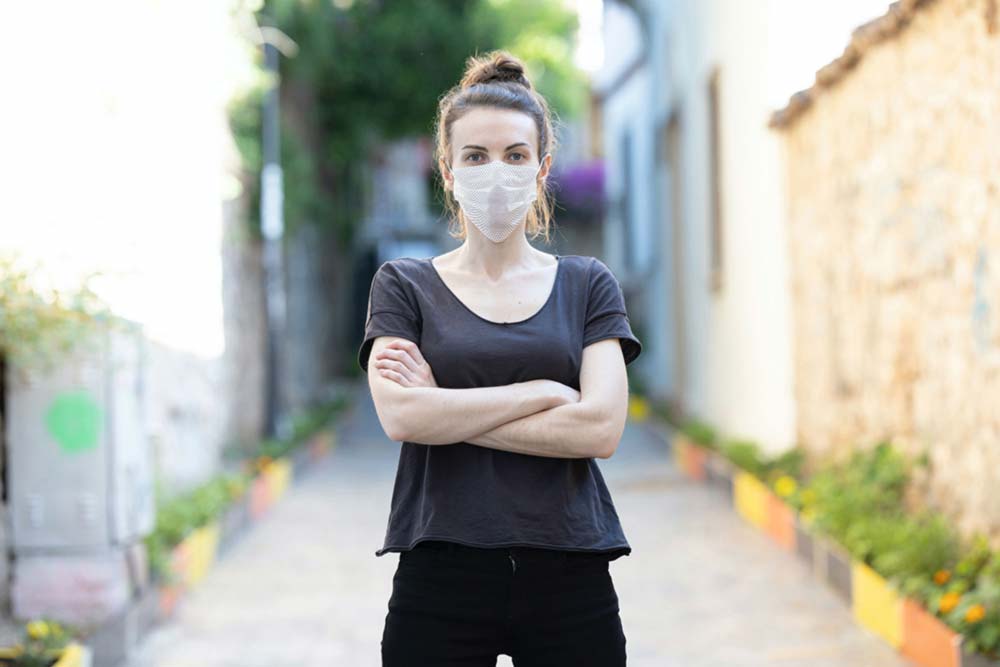 Free Woman Wearing a Face Mask Mockup